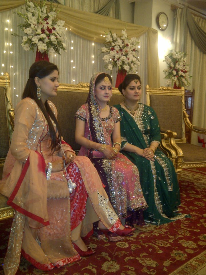 Women in formal wedding outfits